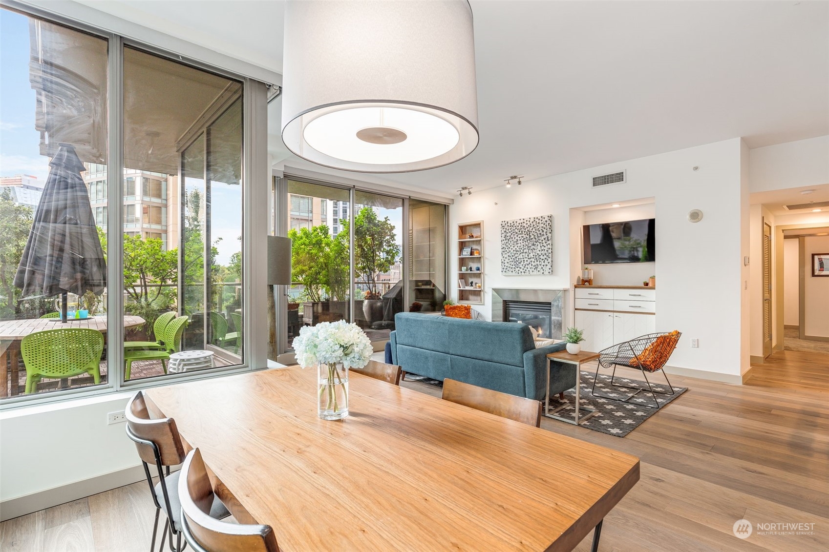910 Lenora Street, Unit S310 Seattle, WA 98121 - Photo 15 of 40 a living room with furniture a wooden floor and a large window