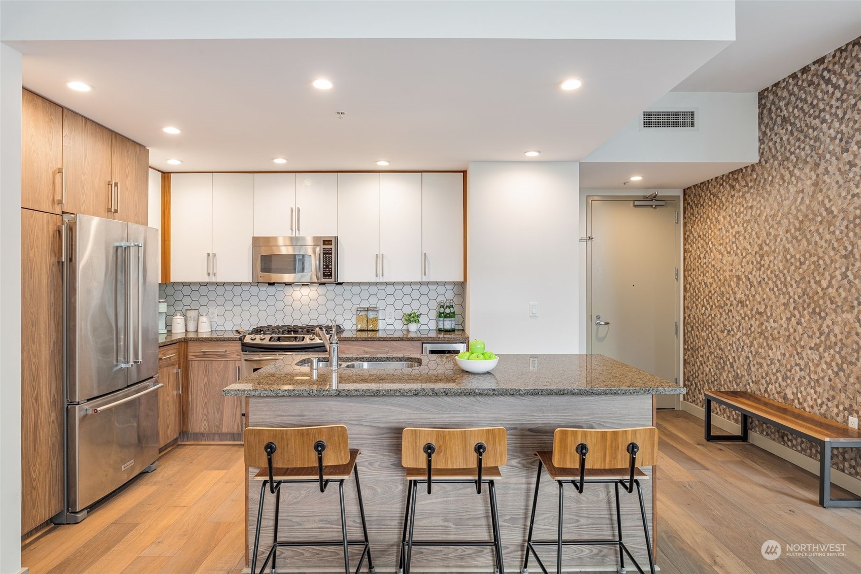 910 Lenora Street, Unit S310 Seattle, WA 98121 - Photo 16 of 40 a kitchen with stainless steel appliances granite countertop a kitchen island a stove and a refrigerator
