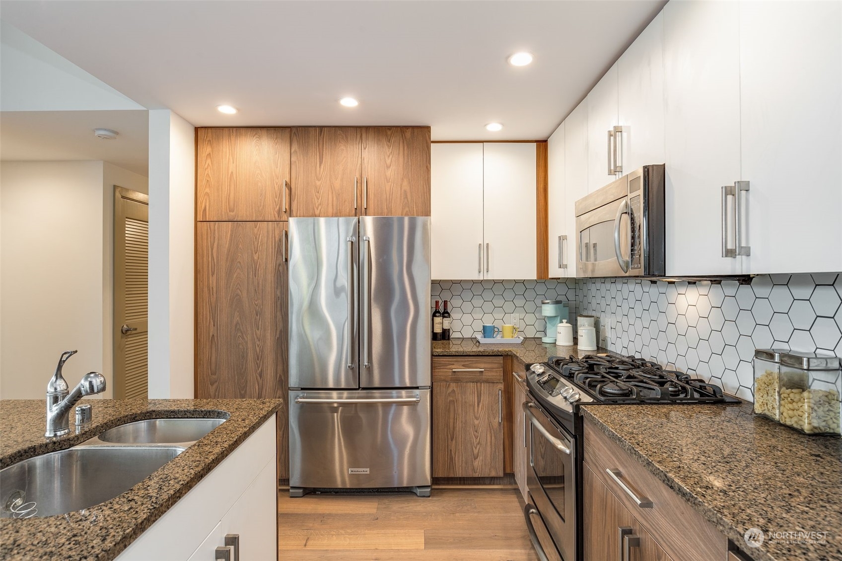 910 Lenora Street, Unit S310 Seattle, WA 98121 - Photo 17 of 40 a kitchen with stainless steel appliances granite countertop a sink stove and refrigerator