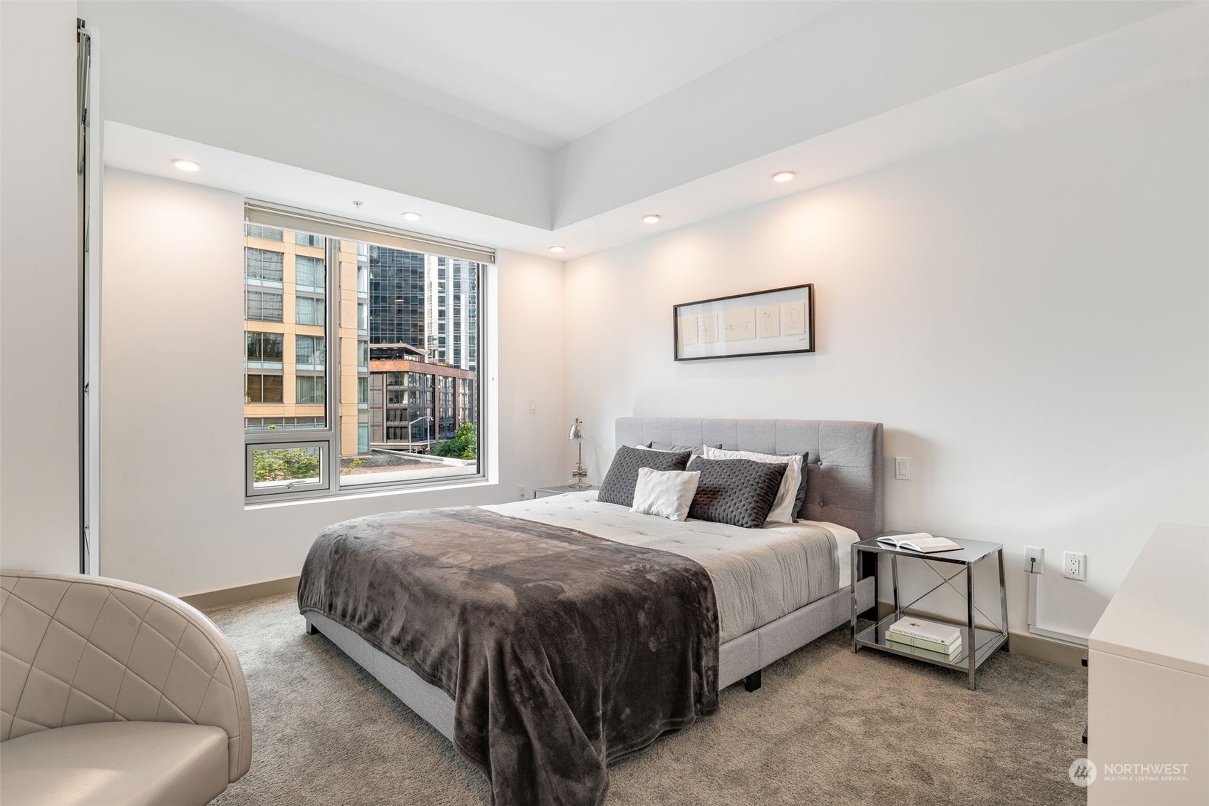 910 Lenora Street, Unit S310 Seattle, WA 98121 - Photo 22 of 40 a bedroom with a bed and a couch