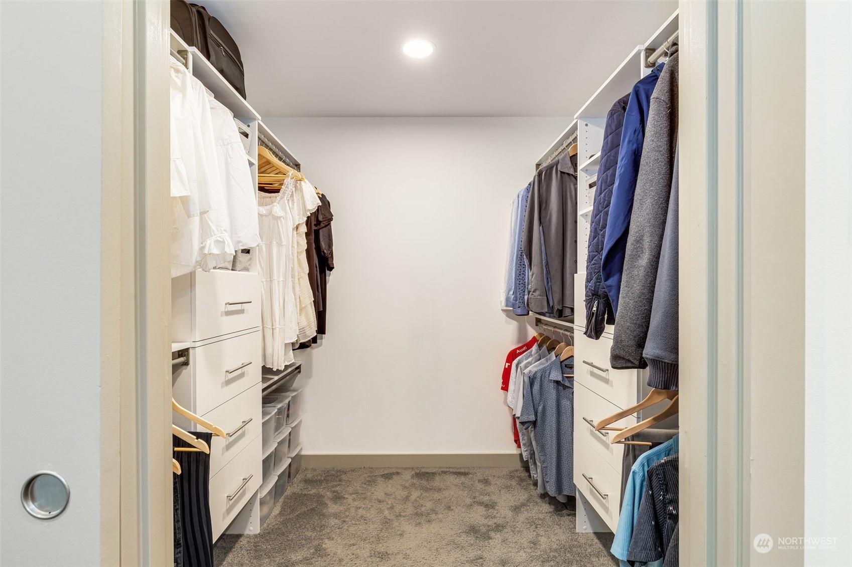 910 Lenora Street, Unit S310 Seattle, WA 98121 - Photo 24 of 40 a view of walk in closet with clothes