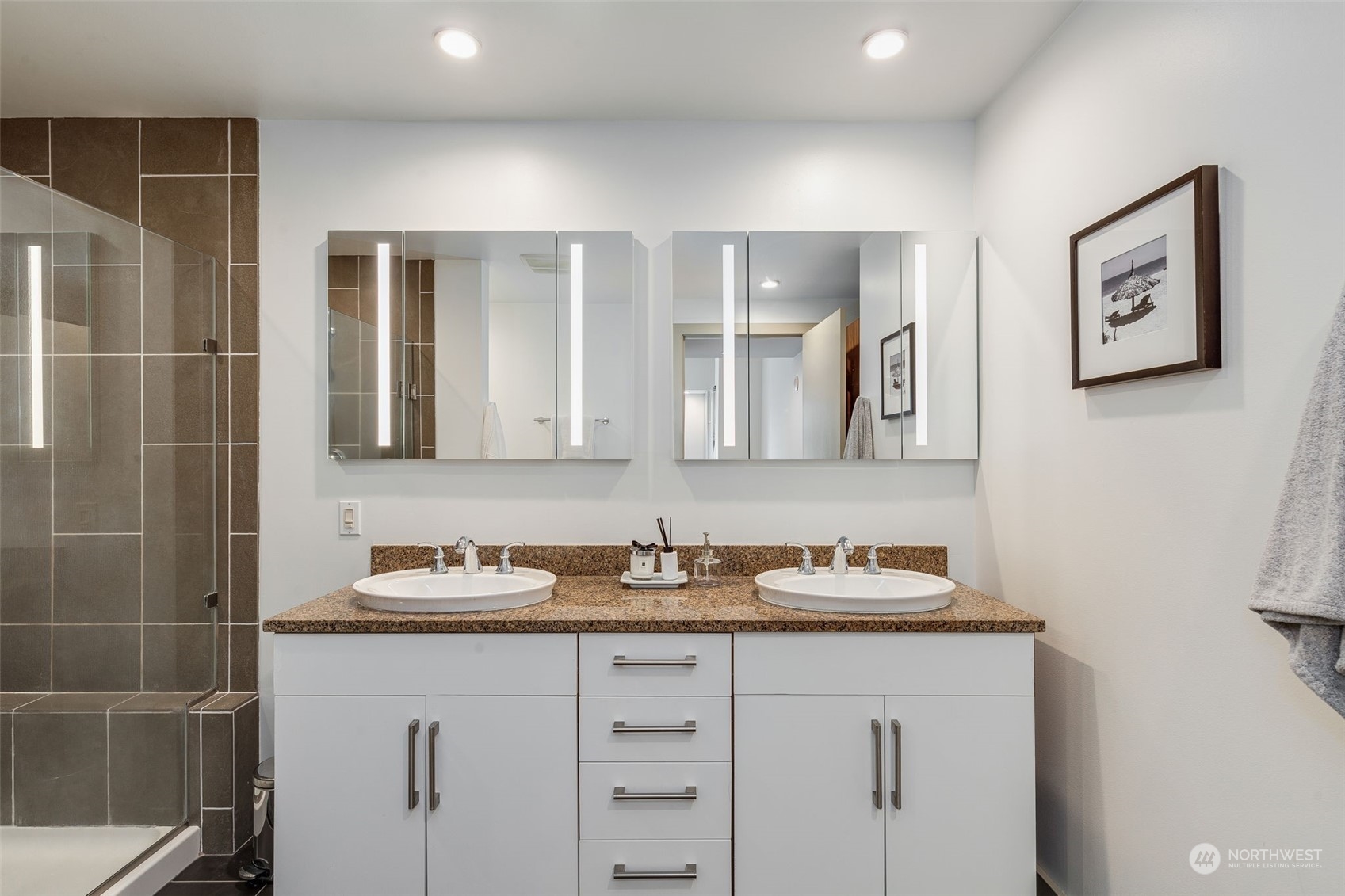 910 Lenora Street, Unit S310 Seattle, WA 98121 - Photo 25 of 40 a bathroom with a granite countertop sink and a mirror