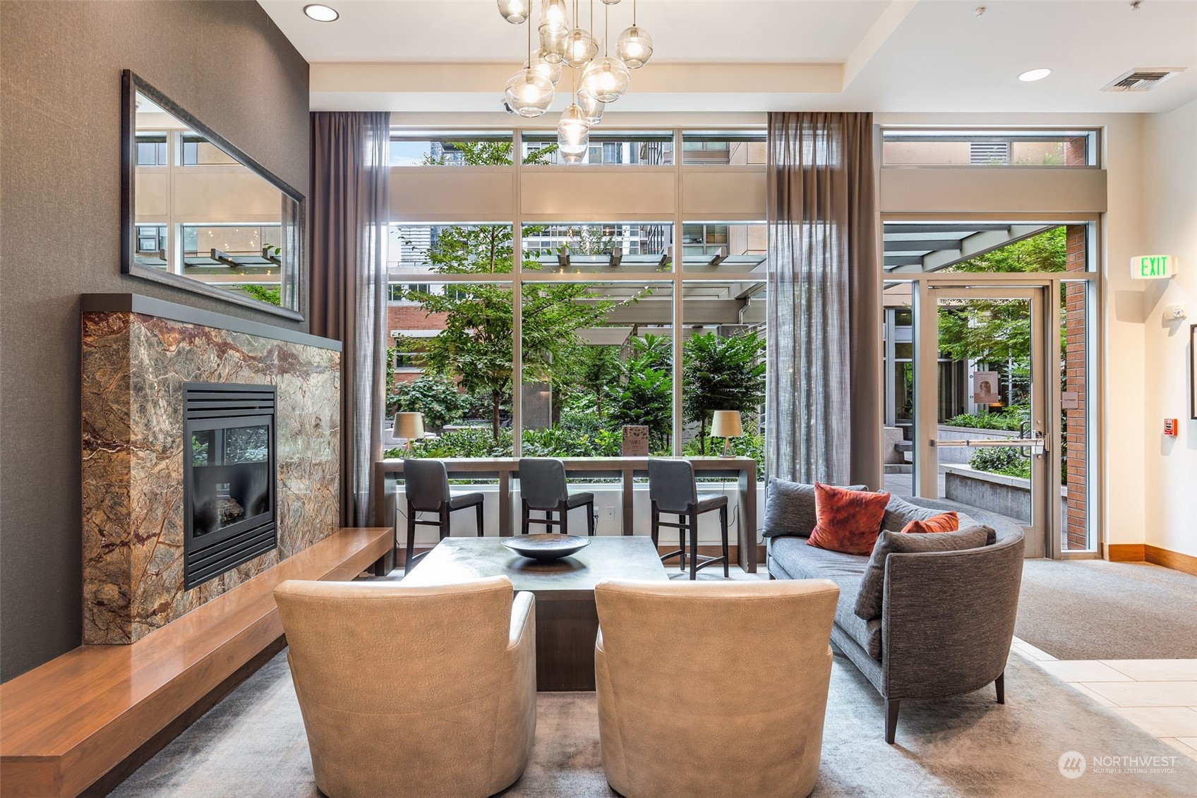 910 Lenora Street, Unit S310 Seattle, WA 98121 - Photo 29 of 40 a living room with fireplace furniture and a large window