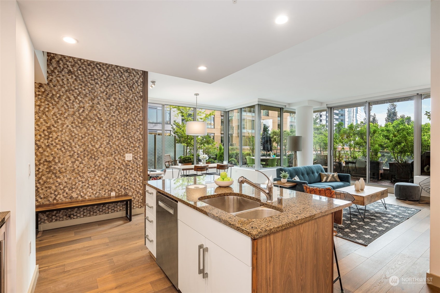 910 Lenora Street, Unit S310 Seattle, WA 98121 - Photo 3 of 40 a kitchen with a sink and large windows