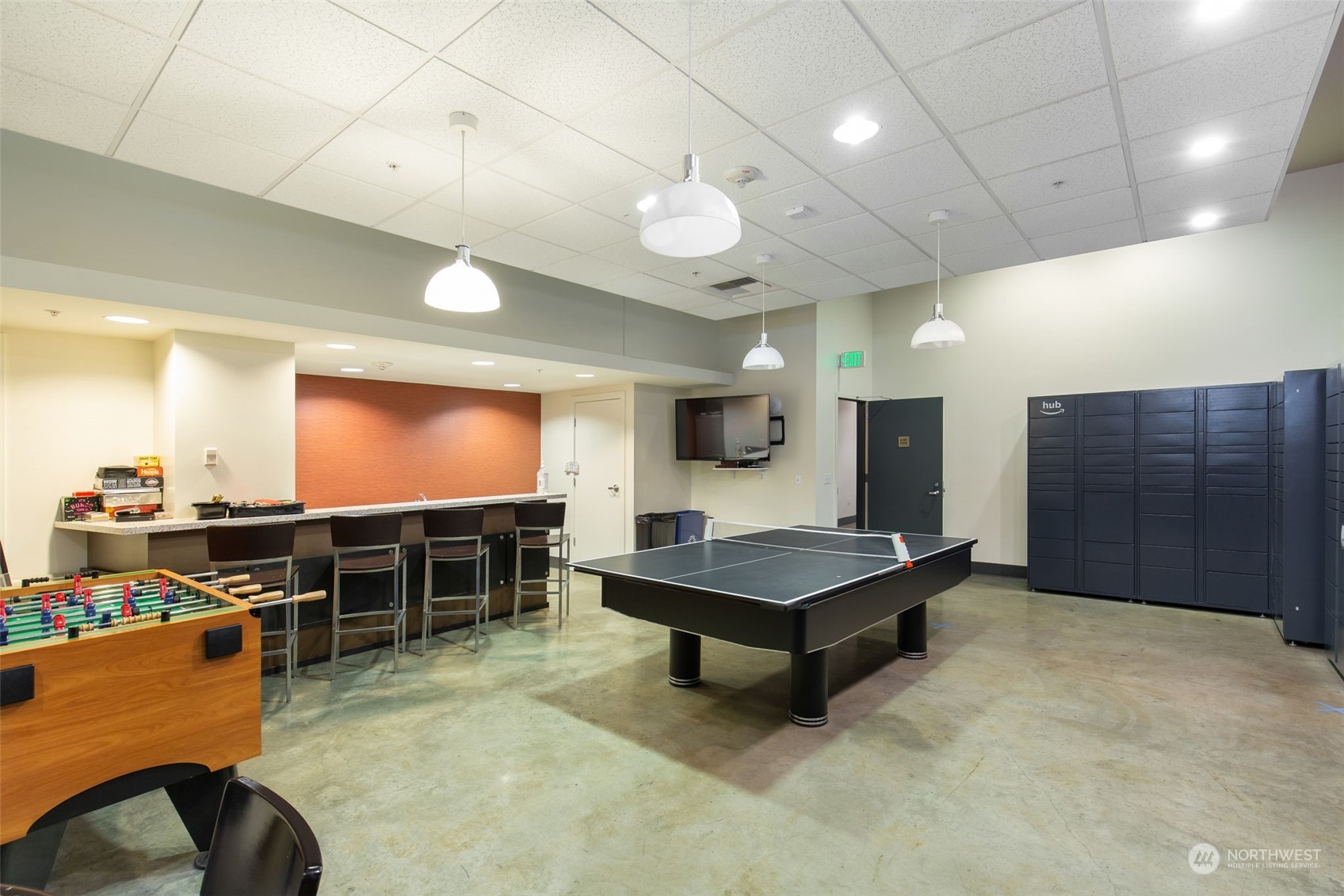 910 Lenora Street, Unit S310 Seattle, WA 98121 - Photo 31 of 40 a room with furniture and a flat screen tv