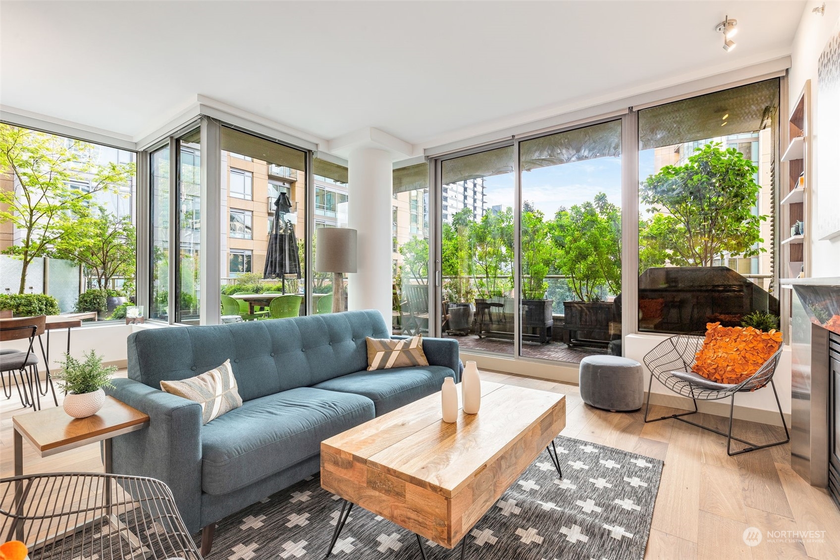 910 Lenora Street, Unit S310 Seattle, WA 98121 - Photo 4 of 40 a living room with furniture and a floor to ceiling window