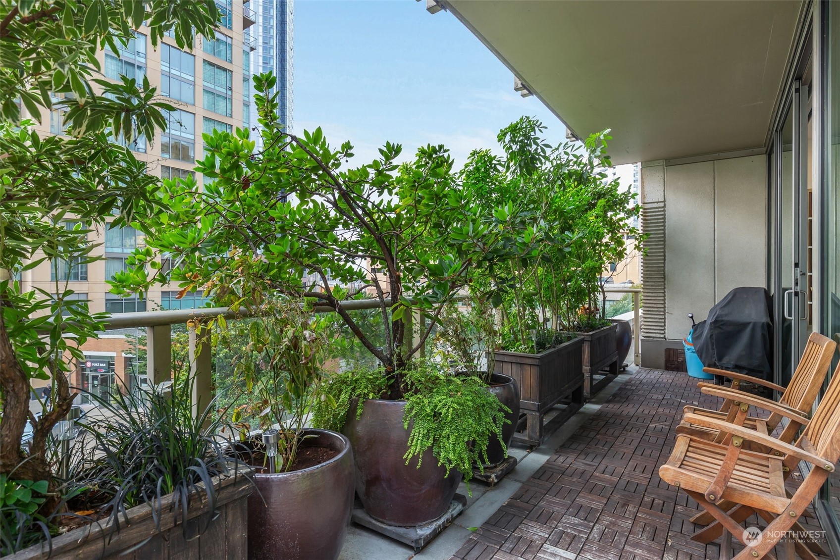 910 Lenora Street, Unit S310 Seattle, WA 98121 - Photo 5 of 40 a view of a porch with chairs and potted plants