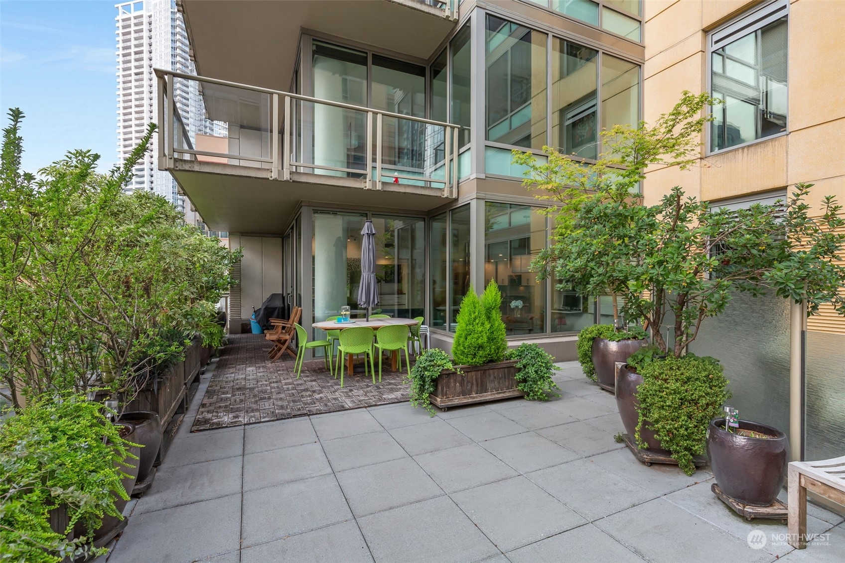 910 Lenora Street, Unit S310 Seattle, WA 98121 - Photo 8 of 40 a view of house with outdoor seating and plants