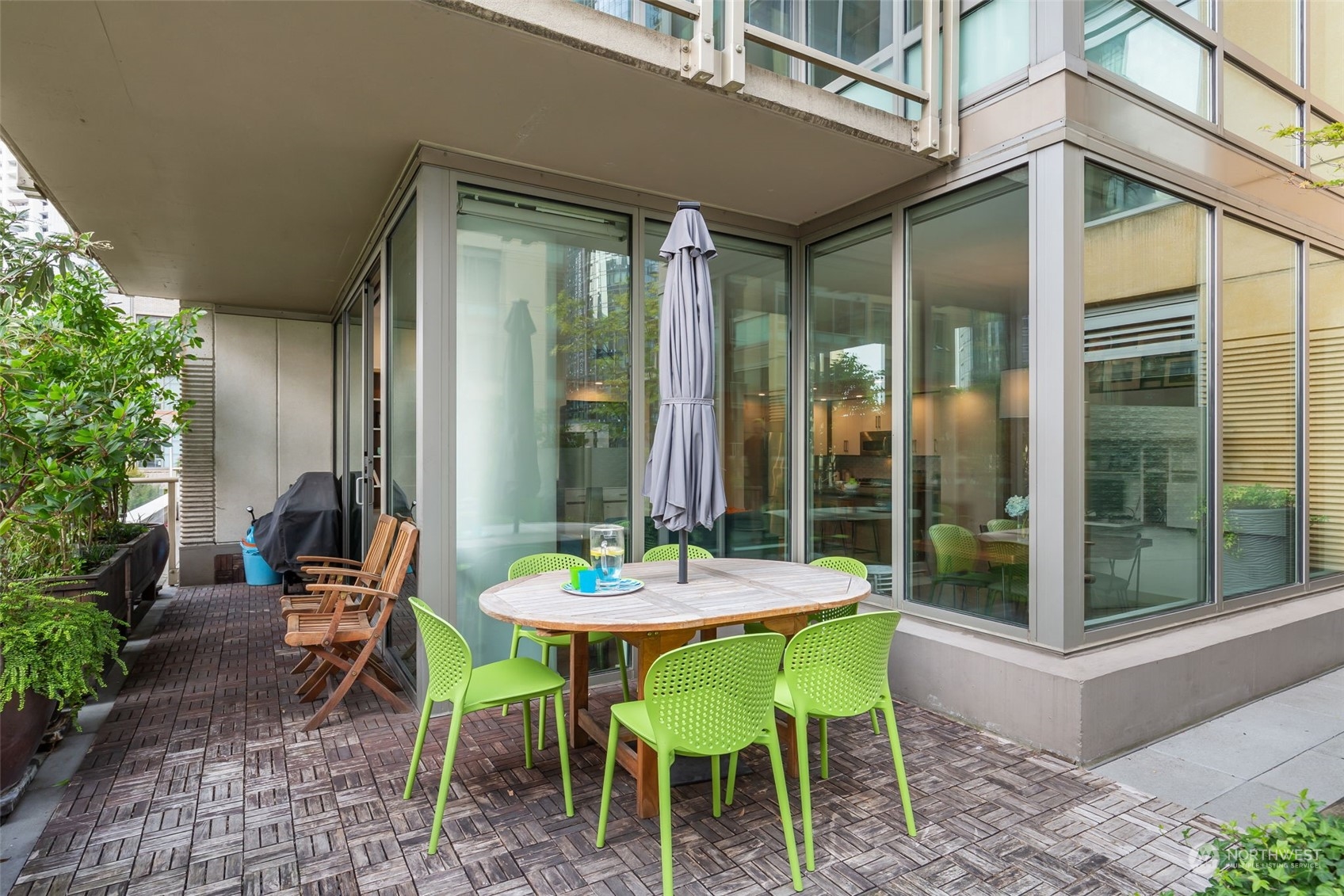910 Lenora Street, Unit S310 Seattle, WA 98121 - Photo 9 of 40 a outdoor dining space with furniture and garden view