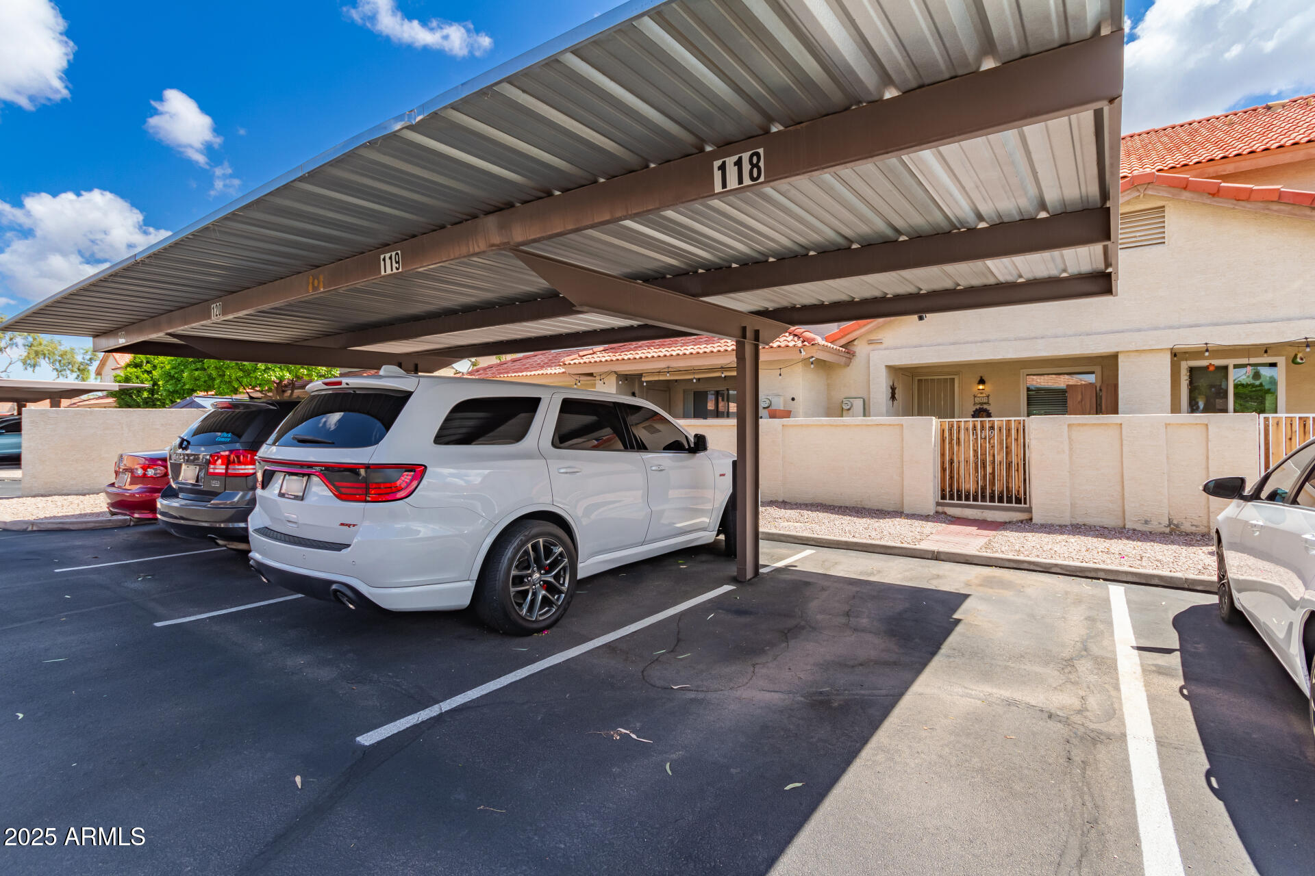 5808 East Brown Road, Unit 119 Mesa, AZ 85205 - Photo 11 of 12 a view of garage with a car parked