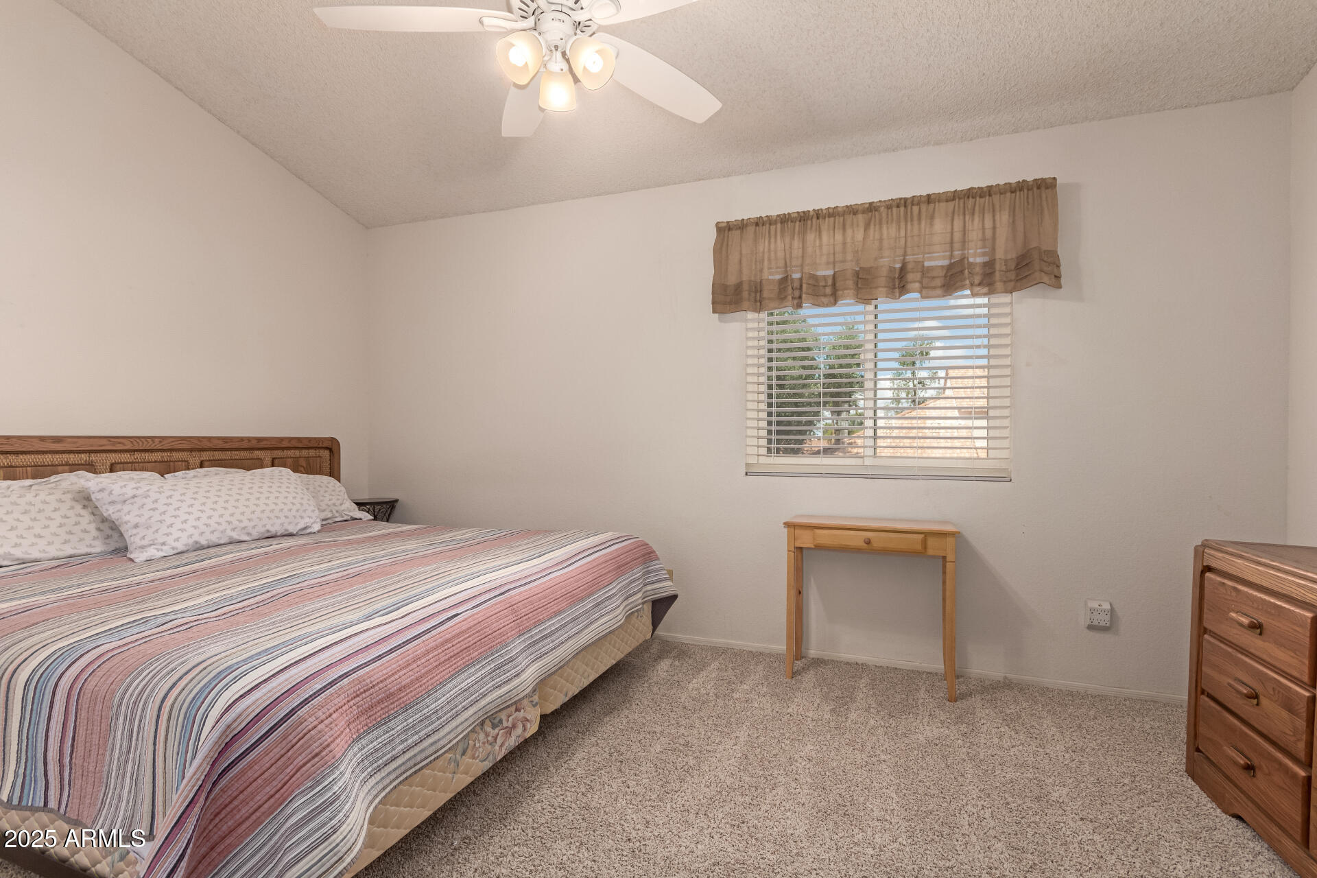 5808 East Brown Road, Unit 119 Mesa, AZ 85205 - Photo 8 of 12 a bedroom with a bed and a window