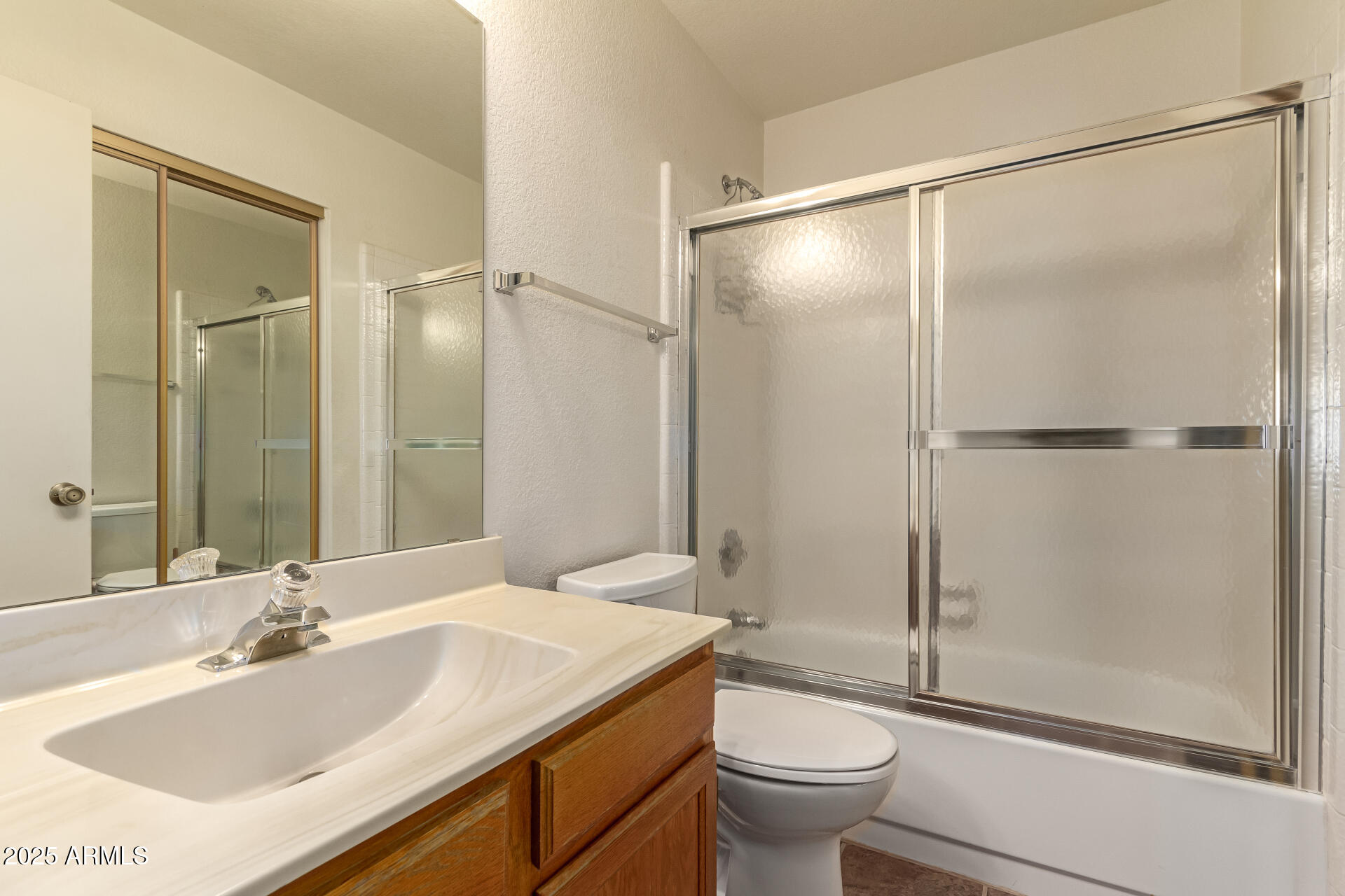 5808 East Brown Road, Unit 119 Mesa, AZ 85205 - Photo 9 of 12 a bathroom with a granite countertop sink toilet and shower