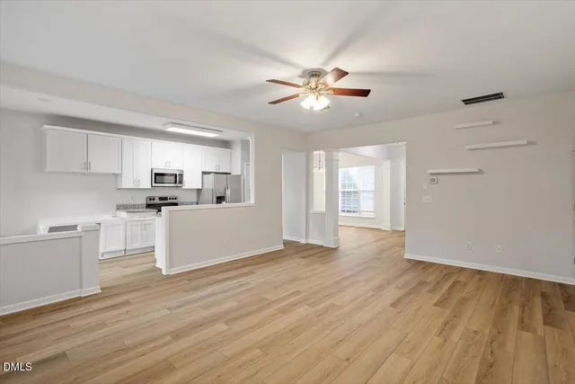 a view of a kitchen with electric appliances