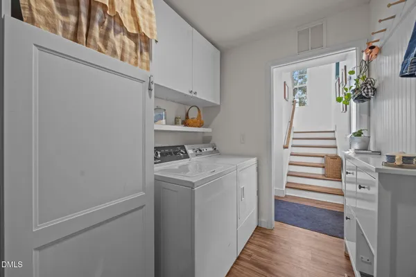 a view of hallway with washer and dryer