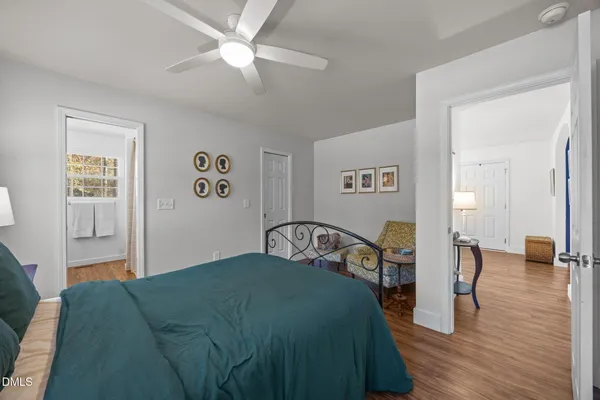 a bedroom with a bed and a view of bedroom