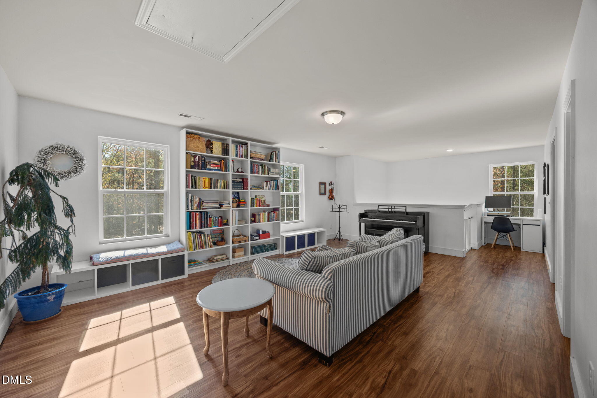 499 Jumping Run Road Dunn, NC 28334 - Photo 18 of 42 a living room with furniture and a book shelf