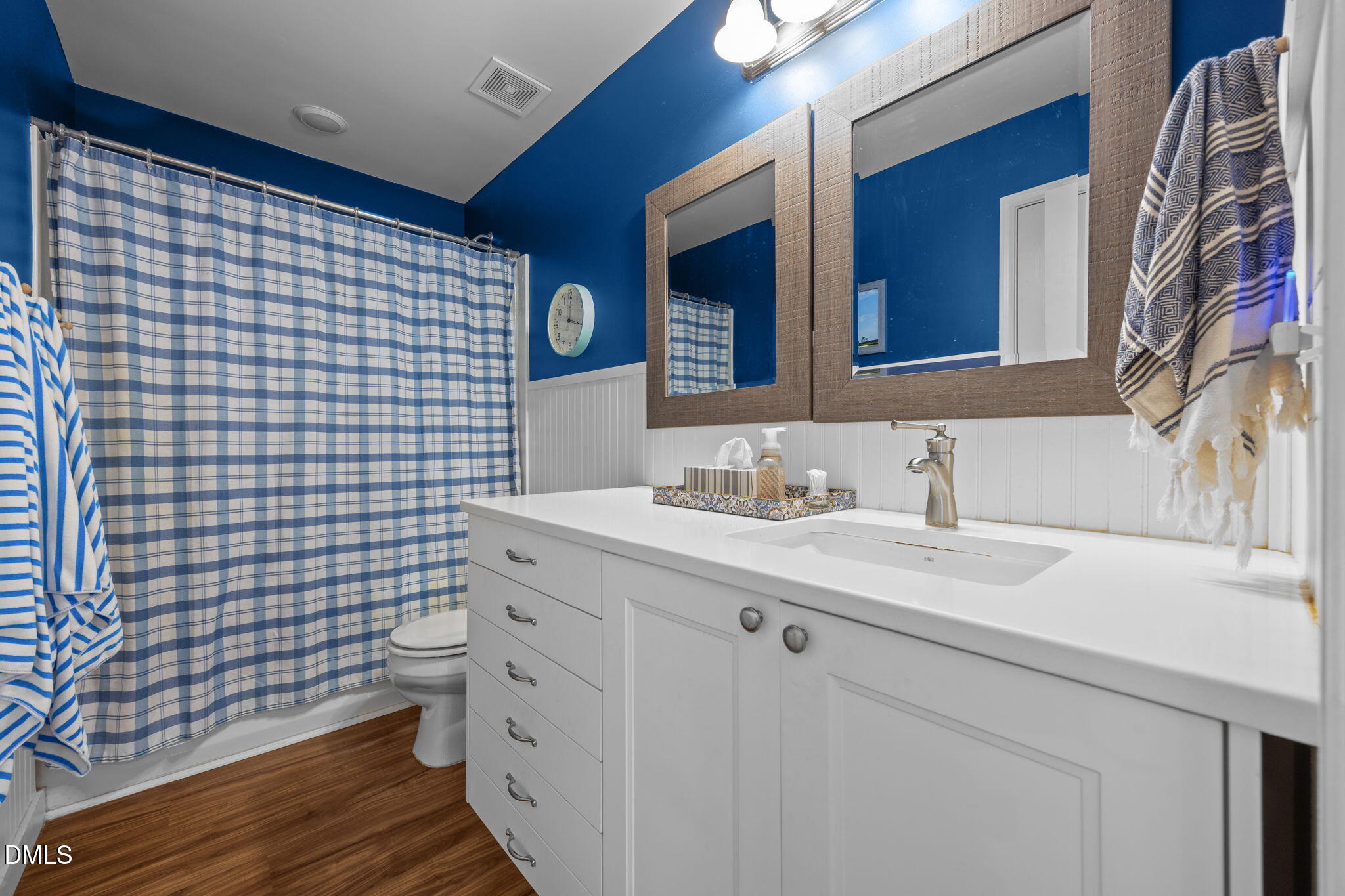 499 Jumping Run Road Dunn, NC 28334 - Photo 24 of 42 a bathroom with a sink mirror vanity and toilet