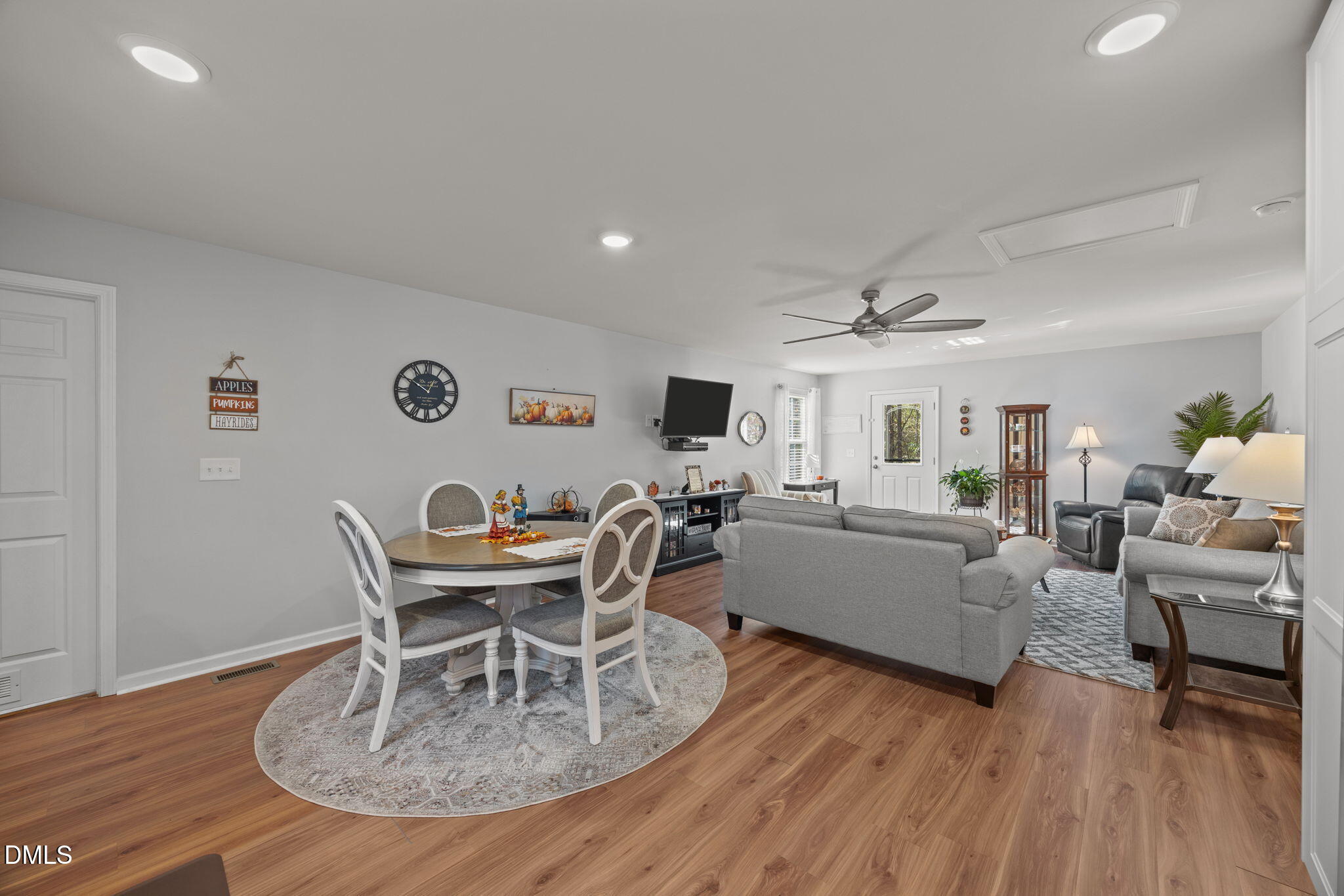 499 Jumping Run Road Dunn, NC 28334 - Photo 33 of 42 a living room with furniture a wooden floor and a table