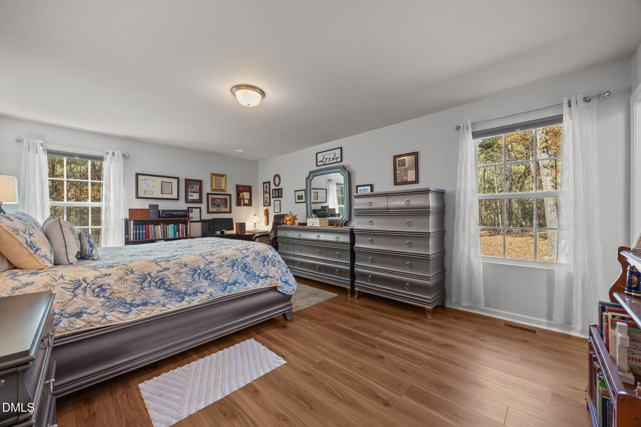 499 Jumping Run Road Dunn, NC 28334 - Photo 36 of 42 a bedroom with a bed closet and a window