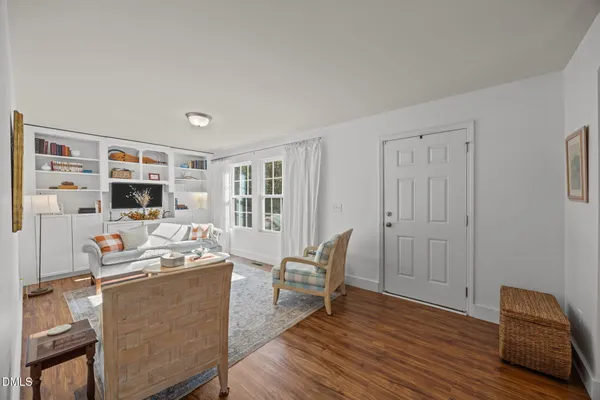 a living room with furniture and flat screen tv