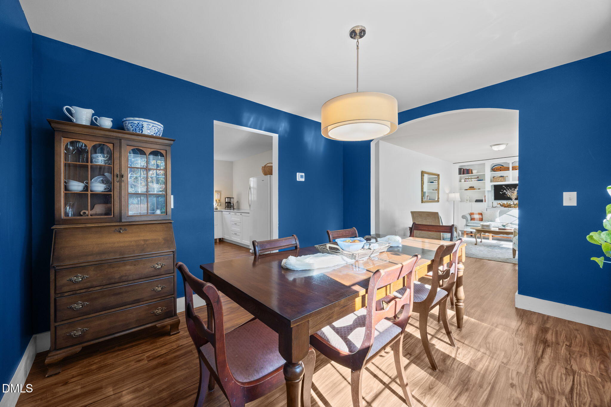 499 Jumping Run Road Dunn, NC 28334 - Photo 8 of 42 a view of a dining room with furniture and wooden floor