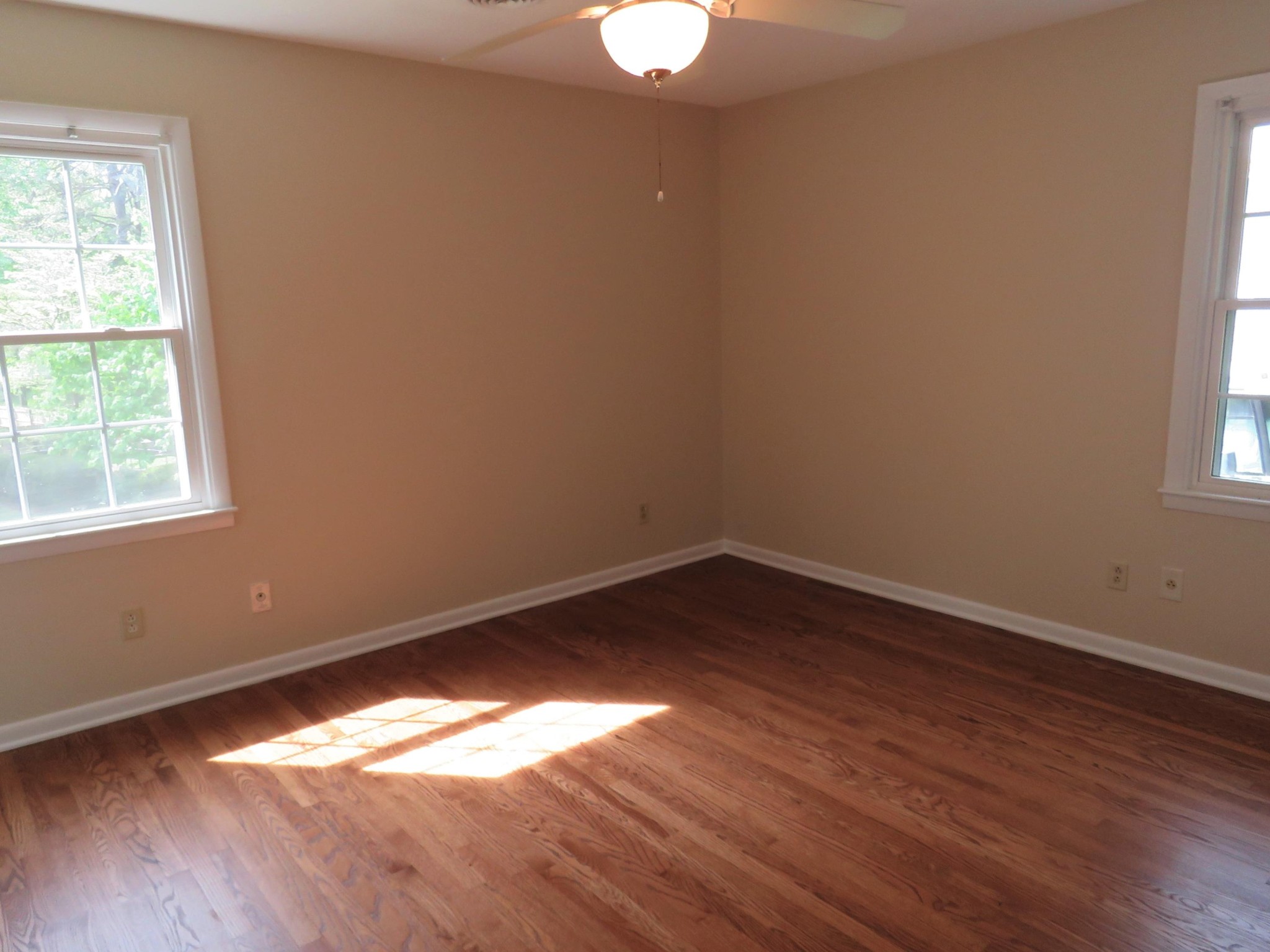 107 Mohawk Road Oak Ridge, TN 37830 - Photo 8 of 25 wooden floor in an empty room with a window