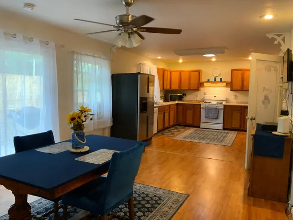 a kitchen with a stove a sink and a refrigerator