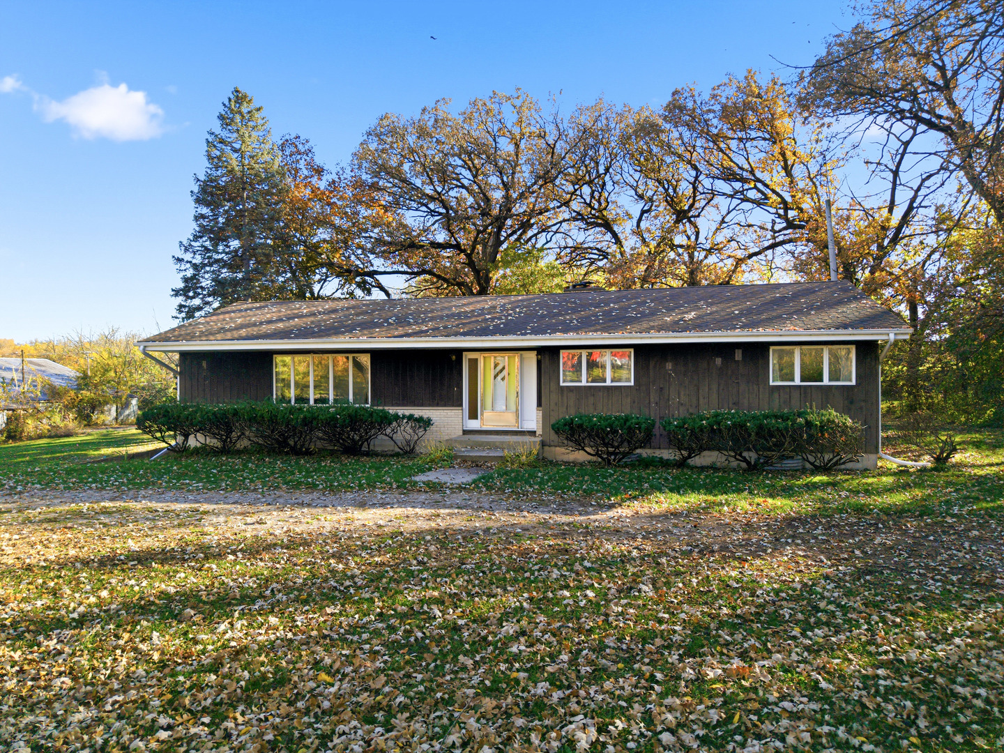a front view of a house with a yard and porch