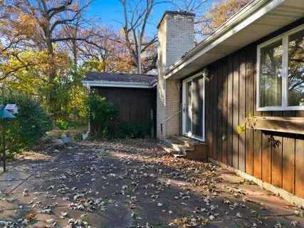 a view of a house with a tree