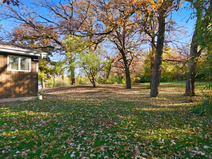a view of a big yard with a house