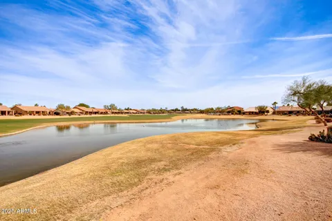 a view of swimming pool with outdoor seating