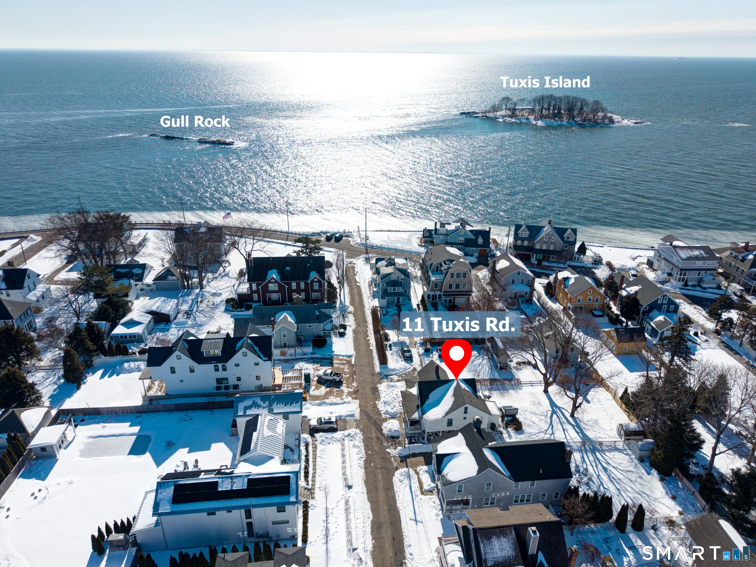 11 Tuxis Road Madison, CT 06443 - Photo 5 of 40 The water is just steps away, offering easy access to the shoreline.