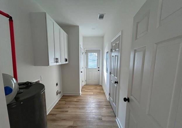 143 Addie Jane Lane Buchanan, GA 30113 - Photo 13 of 31 a view of a hallway with wooden floor and closet area