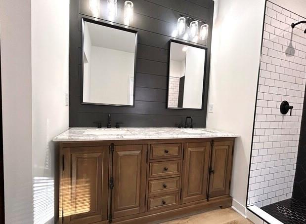 143 Addie Jane Lane Buchanan, GA 30113 - Photo 20 of 31 a bathroom with a sink a mirror and a shower