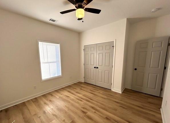 143 Addie Jane Lane Buchanan, GA 30113 - Photo 23 of 31 a view of an empty room with a window and wooden floor