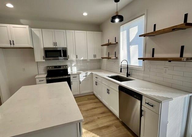 143 Addie Jane Lane Buchanan, GA 30113 - Photo 9 of 31 a kitchen with kitchen island a sink a counter space stainless steel appliances and cabinets