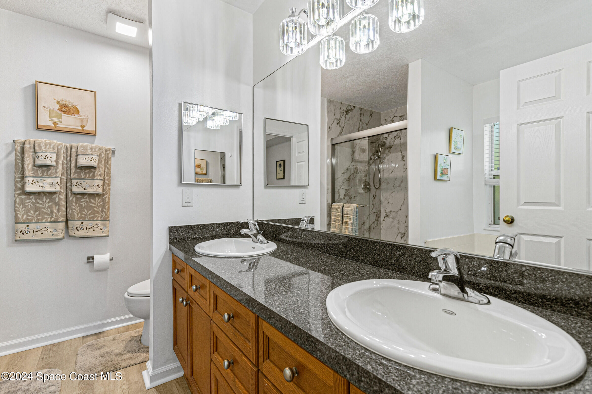 931 Pandora Road Southeast Palm Bay, FL 32909 - Photo 20 of 34 a bathroom with a sink double vanity and a granite
