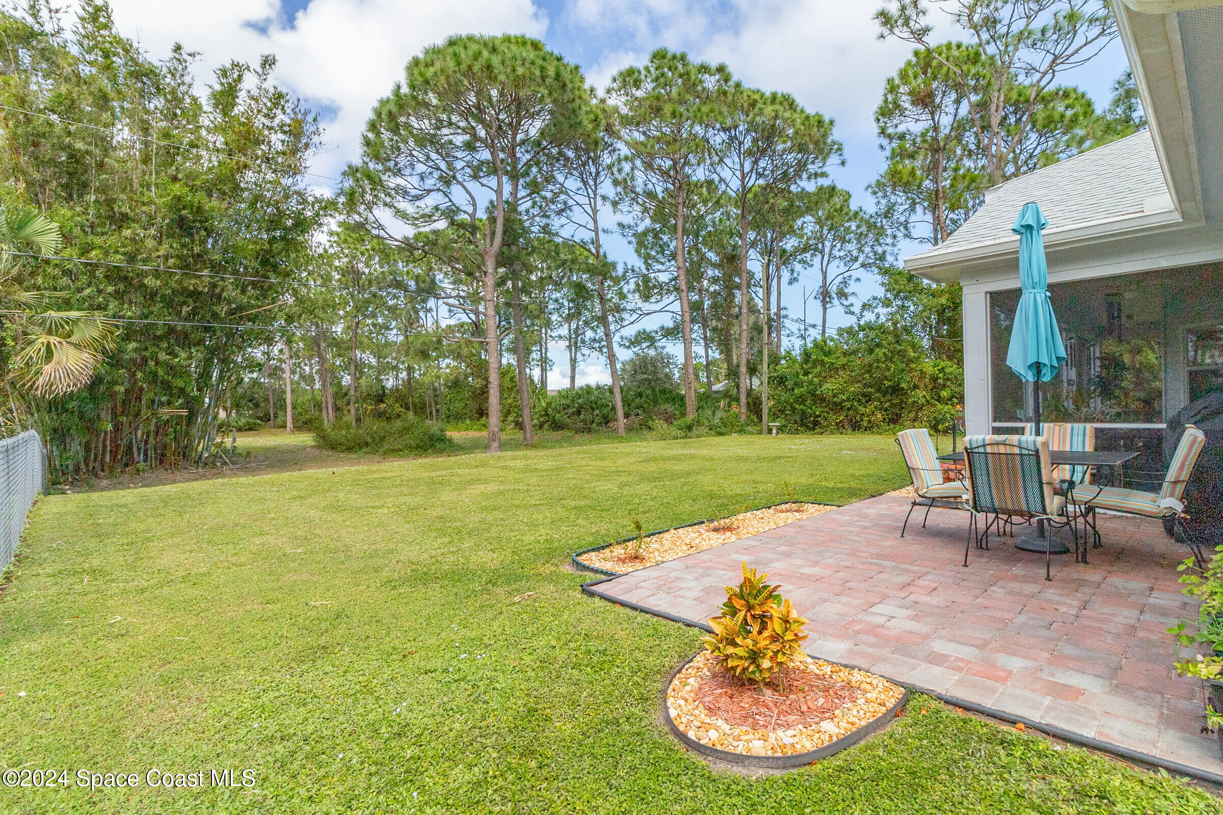 931 Pandora Road Southeast Palm Bay, FL 32909 - Photo 2 of 34 a view of a house with a yard