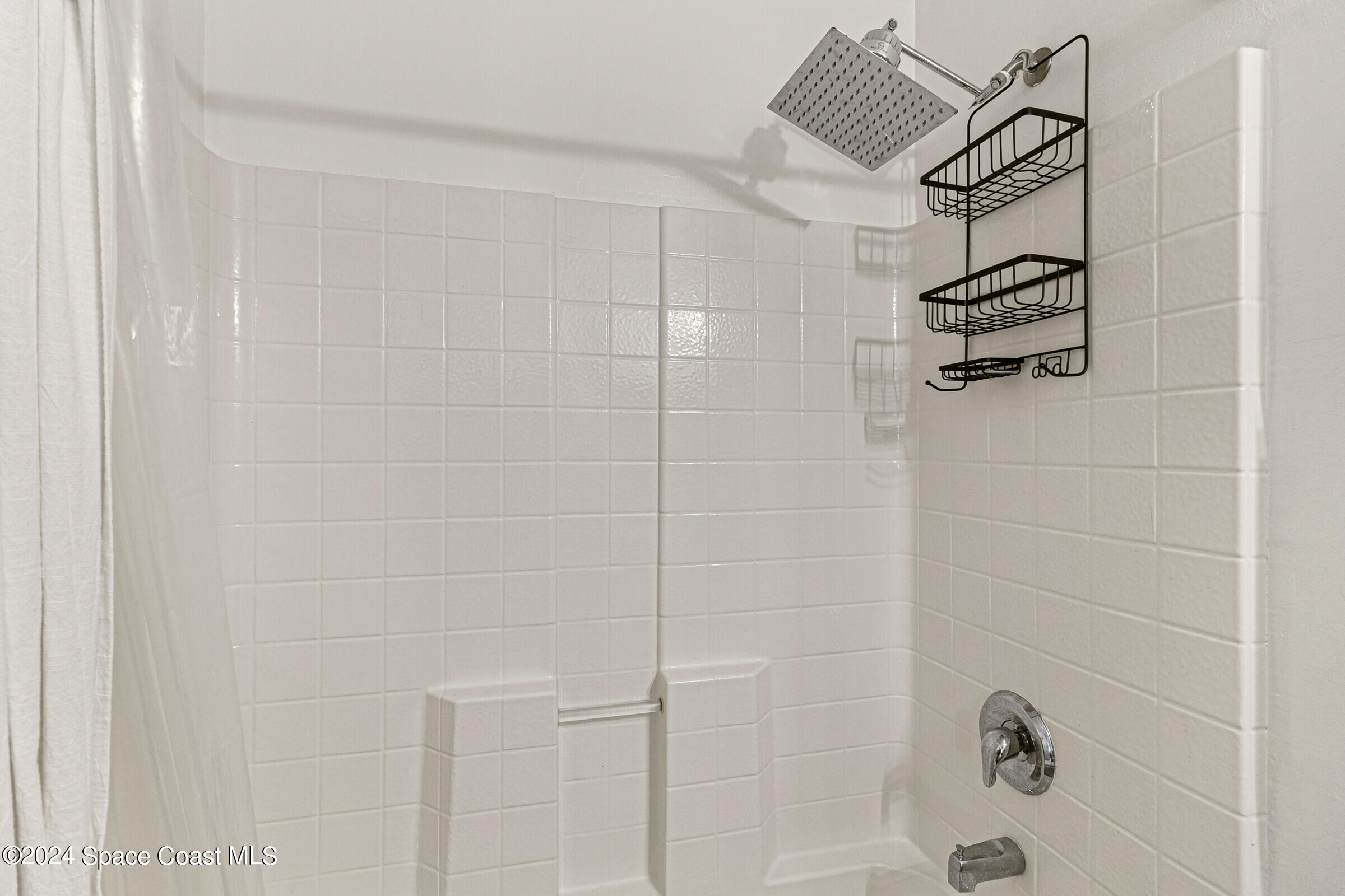931 Pandora Road Southeast Palm Bay, FL 32909 - Photo 26 of 34 a bathroom with a shower