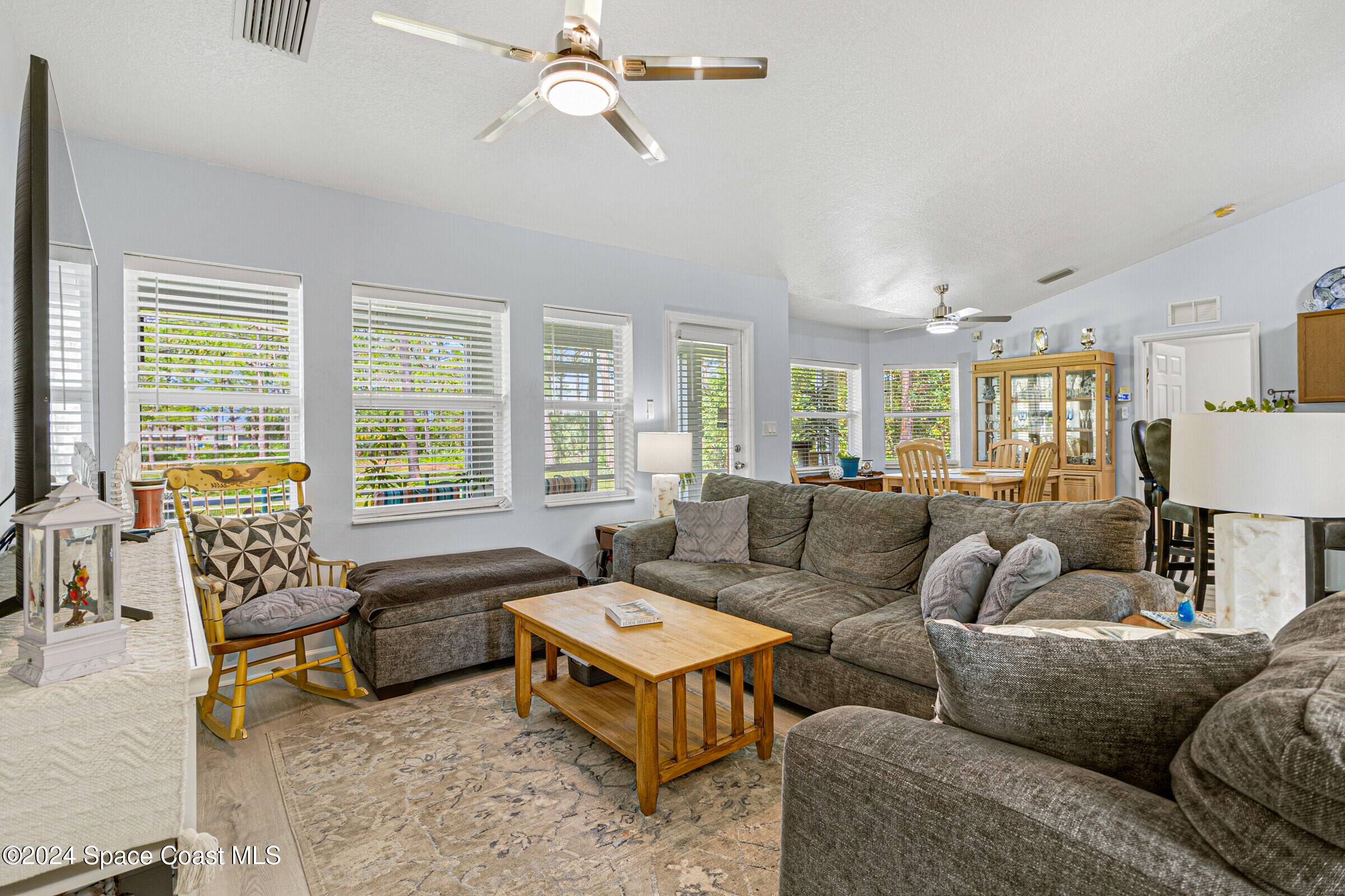 931 Pandora Road Southeast Palm Bay, FL 32909 - Photo 3 of 34 a living room with furniture and a large window