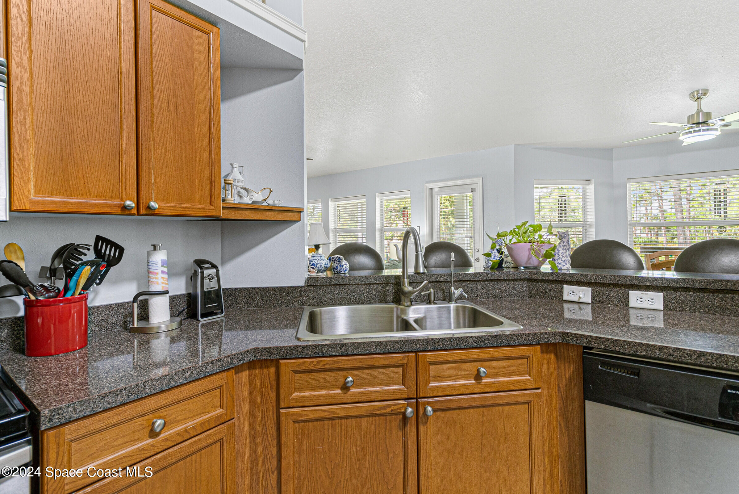 931 Pandora Road Southeast Palm Bay, FL 32909 - Photo 7 of 34 a kitchen with sink and cabinets