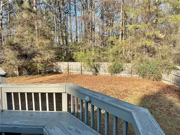 a view of wooden deck and tree