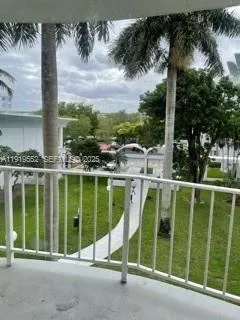 a kitchen with granite countertop a sink stove and cabinets