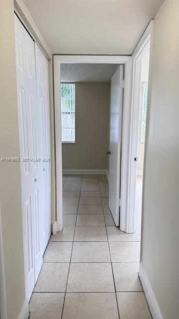 486 Northwest 165th Street, Unit B302 Miami, FL 33169 - Photo 15 of 34 a view of a hallway to rooms