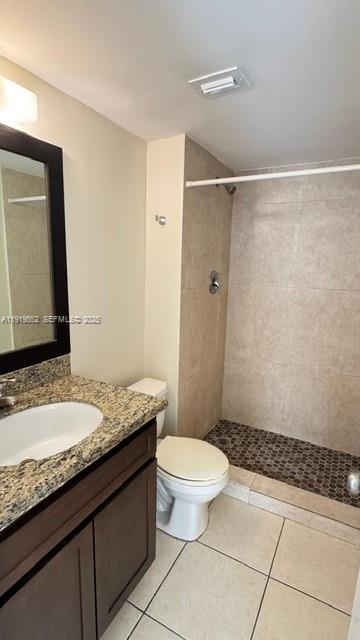 486 Northwest 165th Street, Unit B302 Miami, FL 33169 - Photo 23 of 34 a bathroom with a granite countertop sink toilet mirror and shower