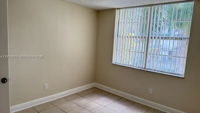 a view of a room that has a window in it