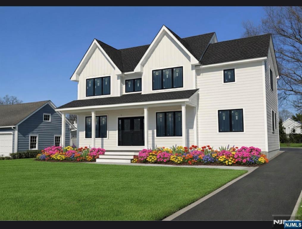 615 Shelton Road Ridgewood, NJ 07450 - Photo 7 of 7 a front view of a house with a yard