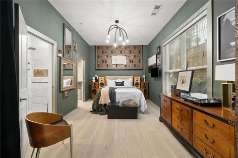 a bedroom with bed and window
