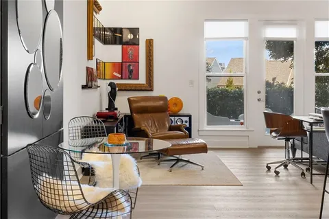 a bedroom with furniture and flat screen tv