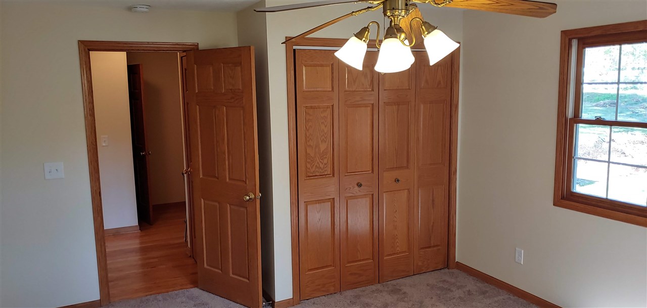 20979 Free Church Road Caledonia, IL 61011 - Photo 21 of 40 an empty room with windows and closet